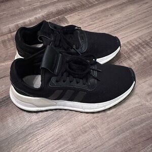 Mildly worn Adidas tennis shoes practical for every day or Active wear.